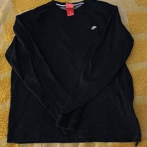 Nike, woman’s M, black pull over sweater with zipper on one side & cuffed wrist.